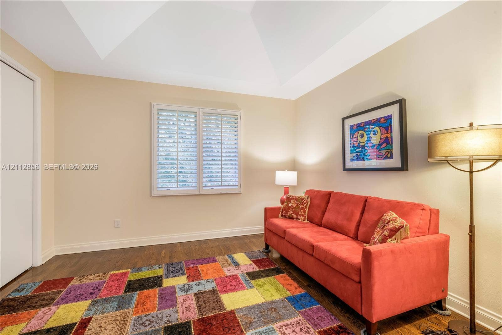 285 Las Brisas Court, Coral Gables, FL 33143 Vaulted ceiling, wood-finish flooring, and window shutters