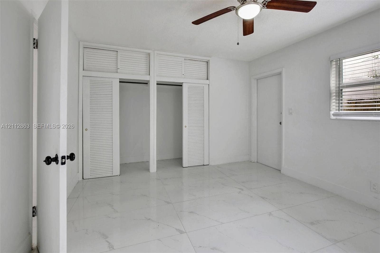 1520 NE 56th Street, #4, Fort Lauderdale, Fort Lauderdale, FL 33334 Large-format tile flooring, dual closets with overhead storage, and ceiling fan with integrated lighting