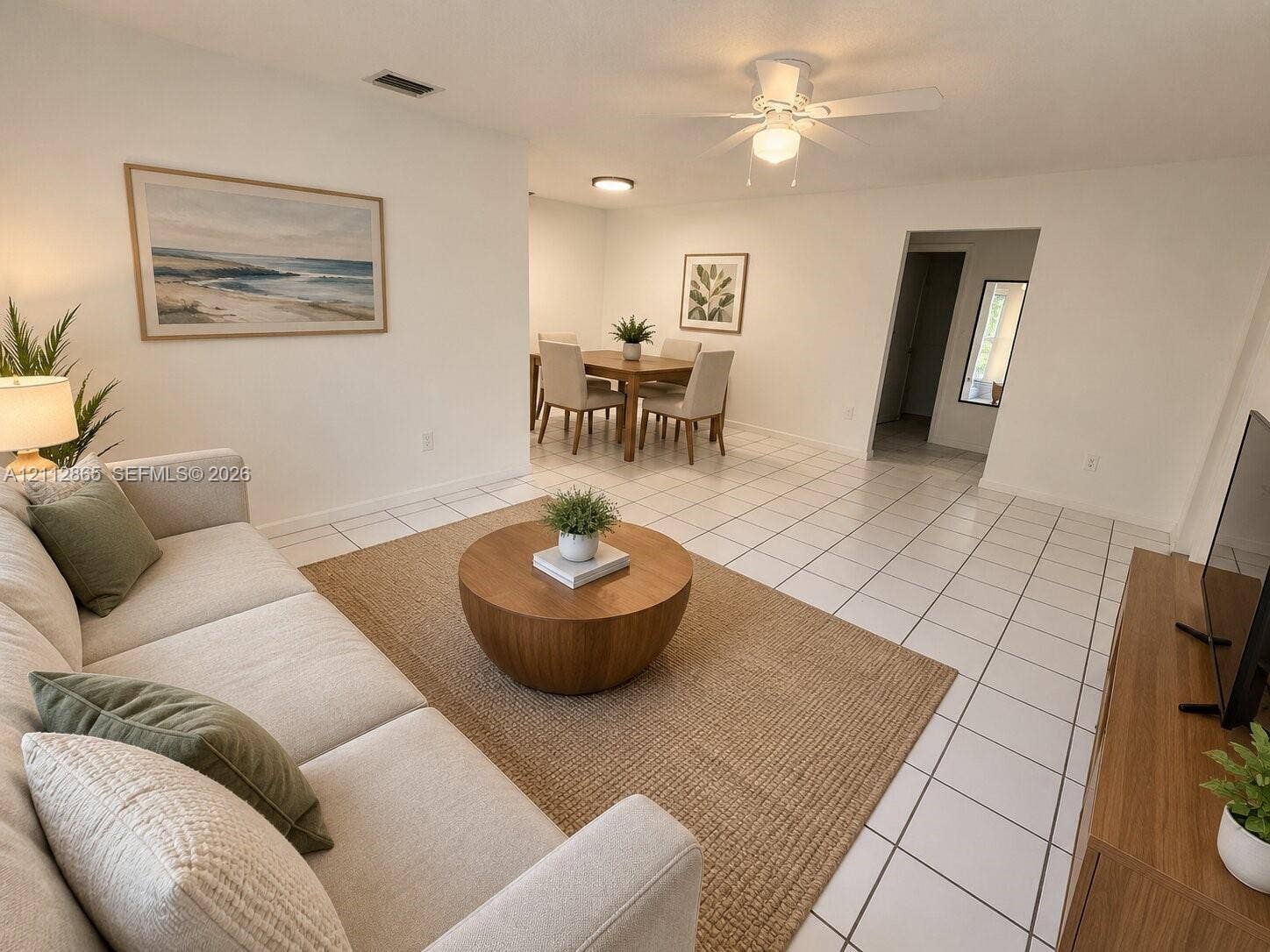 Ceramic tile flooring, neutral wall finishes, and a ceiling fan with integrated lighting