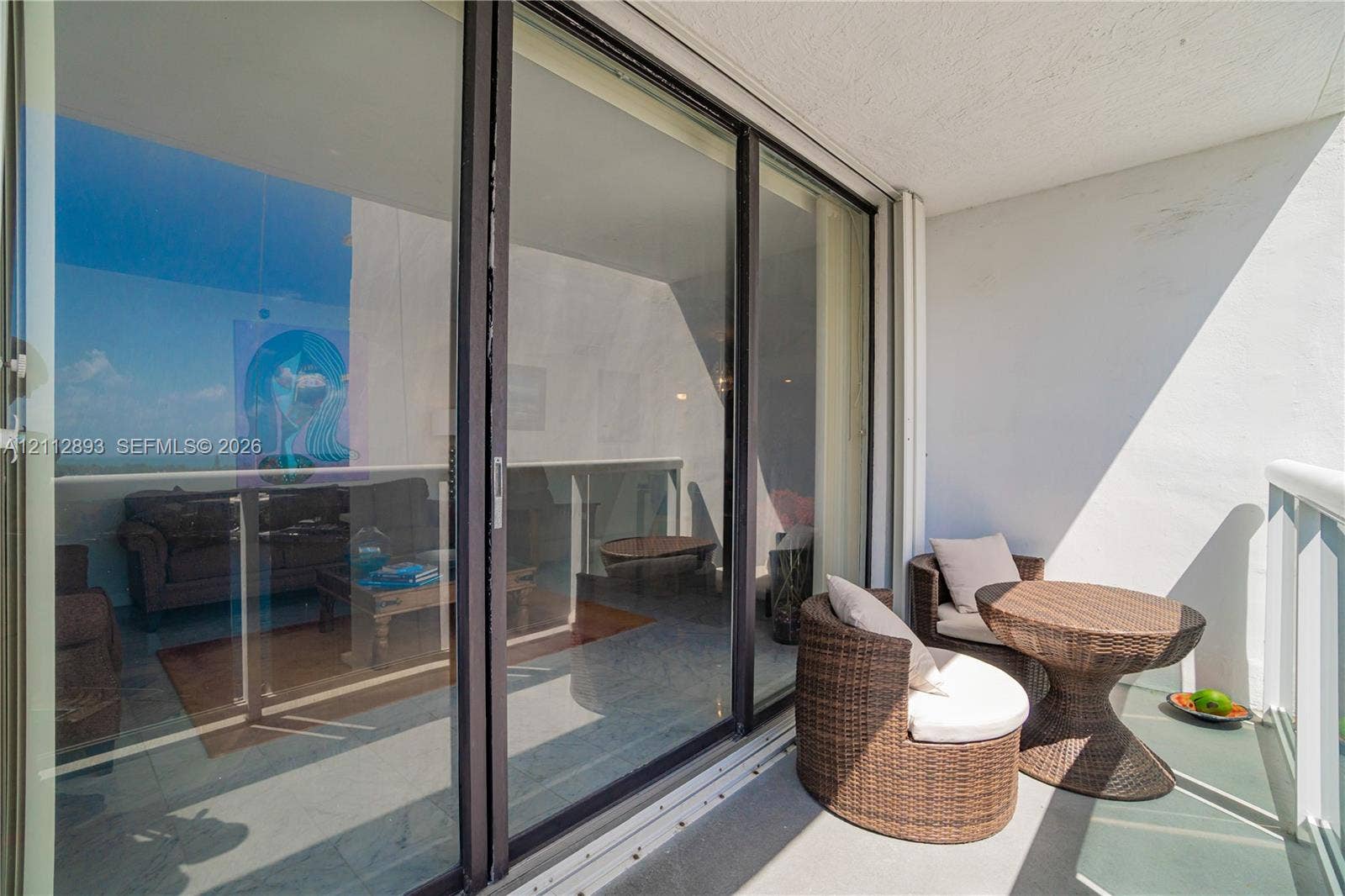 20515 E Country Club Drive, #1048, Aventura, FL 33180 Private balcony featuring sliding glass doors and glass-paneled railings