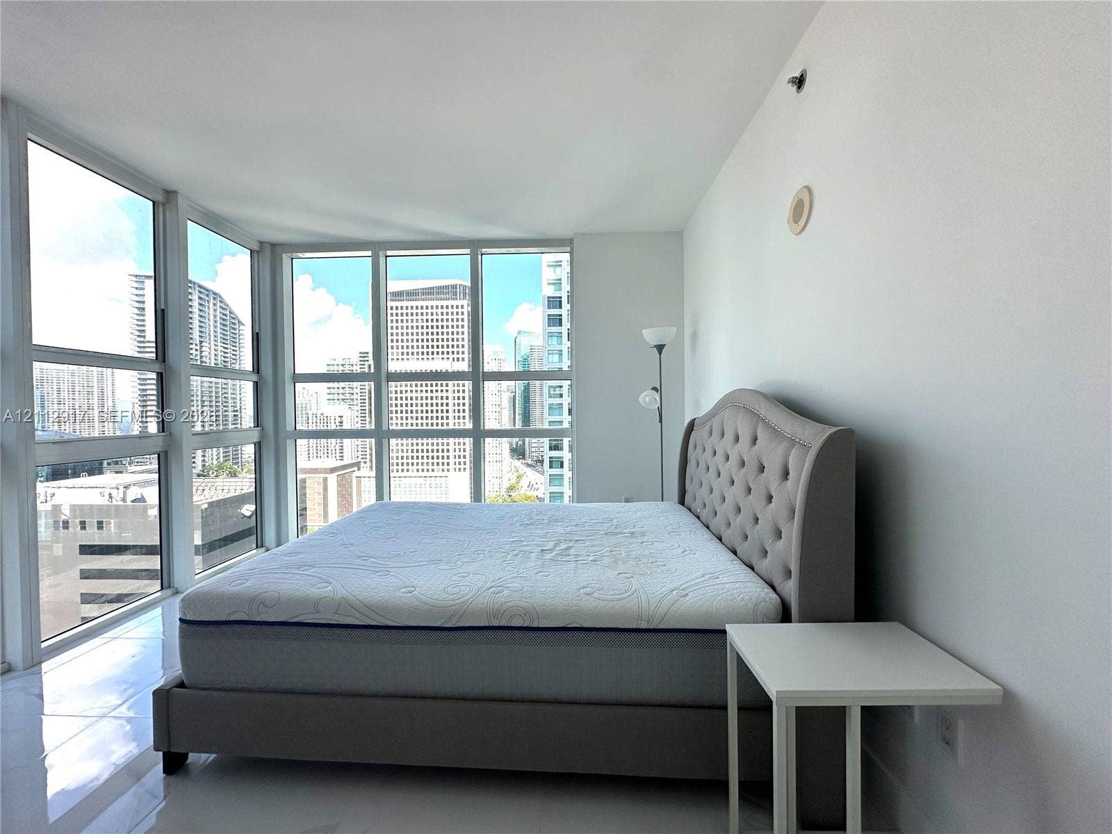 951 Brickell Avenue, #2601, Miami, Miami, FL 33131 Interior featuring large multi-pane windows with grid frames, white walls, and smooth-surface flooring