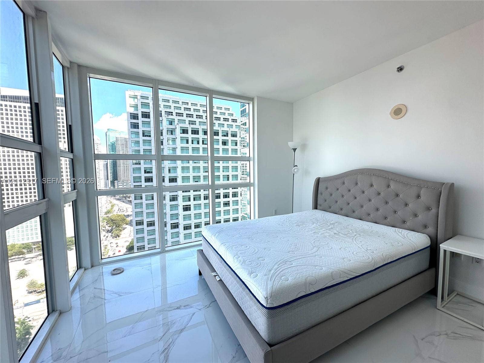 951 Brickell Avenue, #2601, Miami, Miami, FL 33131 Floor-to-ceiling windows featuring urban scenery and large-format polished tile flooring
