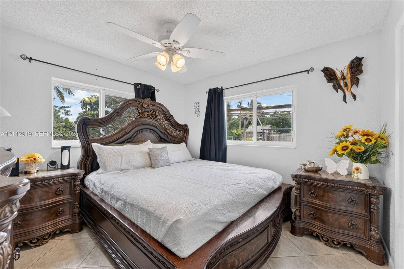 2120 NW 28th Terrace, Fort Lauderdale, FL 33311 Neutral walls, light-toned tile flooring, and a ceiling fan with integrated lighting