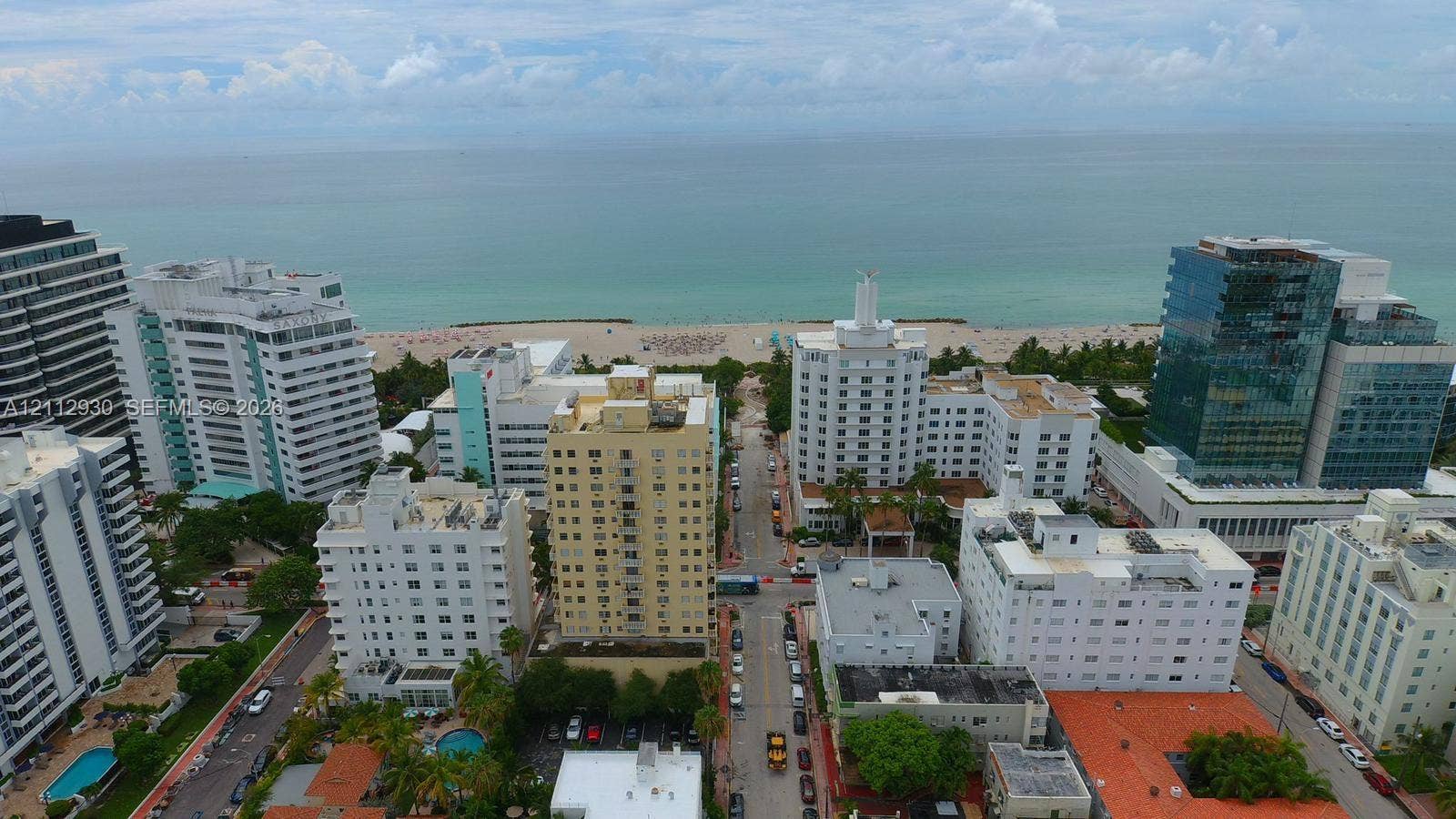 3030 Collins Avenue, #1G, Miami Beach, FL 33140 Aerial perspective of an urban coastal setting featuring high-rise architecture and direct oceanfront access to the beach