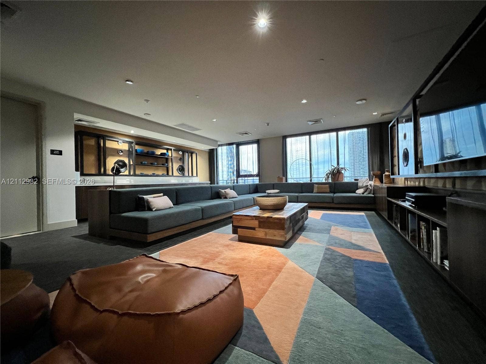 121 NE 34th Street, #903, Miami, FL 33137 Built-in cabinetry with integrated shelving, recessed lighting, and expansive floor-to-ceiling windows