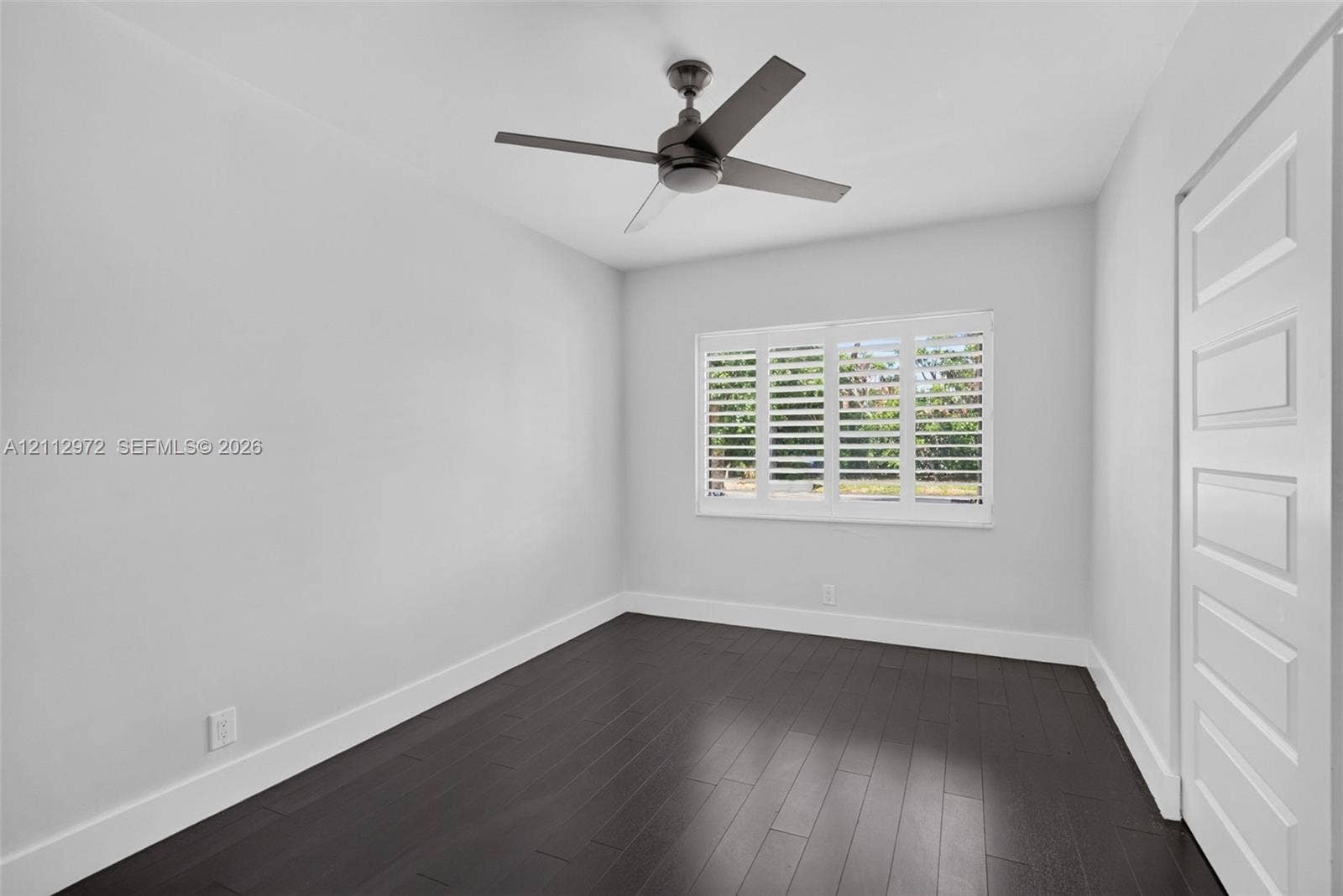 549 NE 12th Avenue, #0, Fort Lauderdale, Fort Lauderdale, FL 33301 Room featuring wood-finish flooring, plantation shutters, and a four-blade ceiling fan