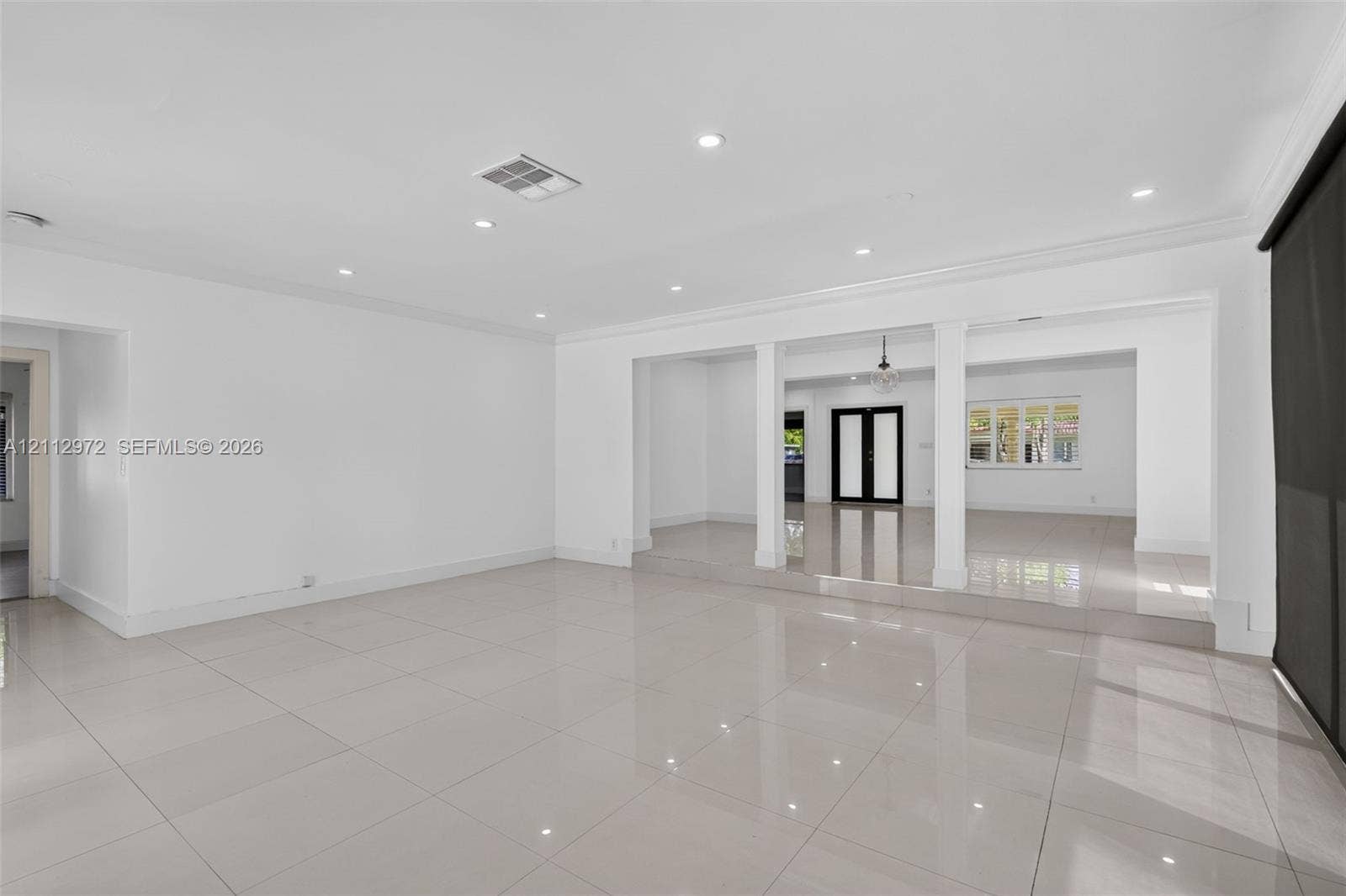 549 NE 12th Avenue, #0, Fort Lauderdale, Fort Lauderdale, FL 33301 Open-concept interior featuring large-format tile flooring, recessed lighting, crown molding, and structural columns