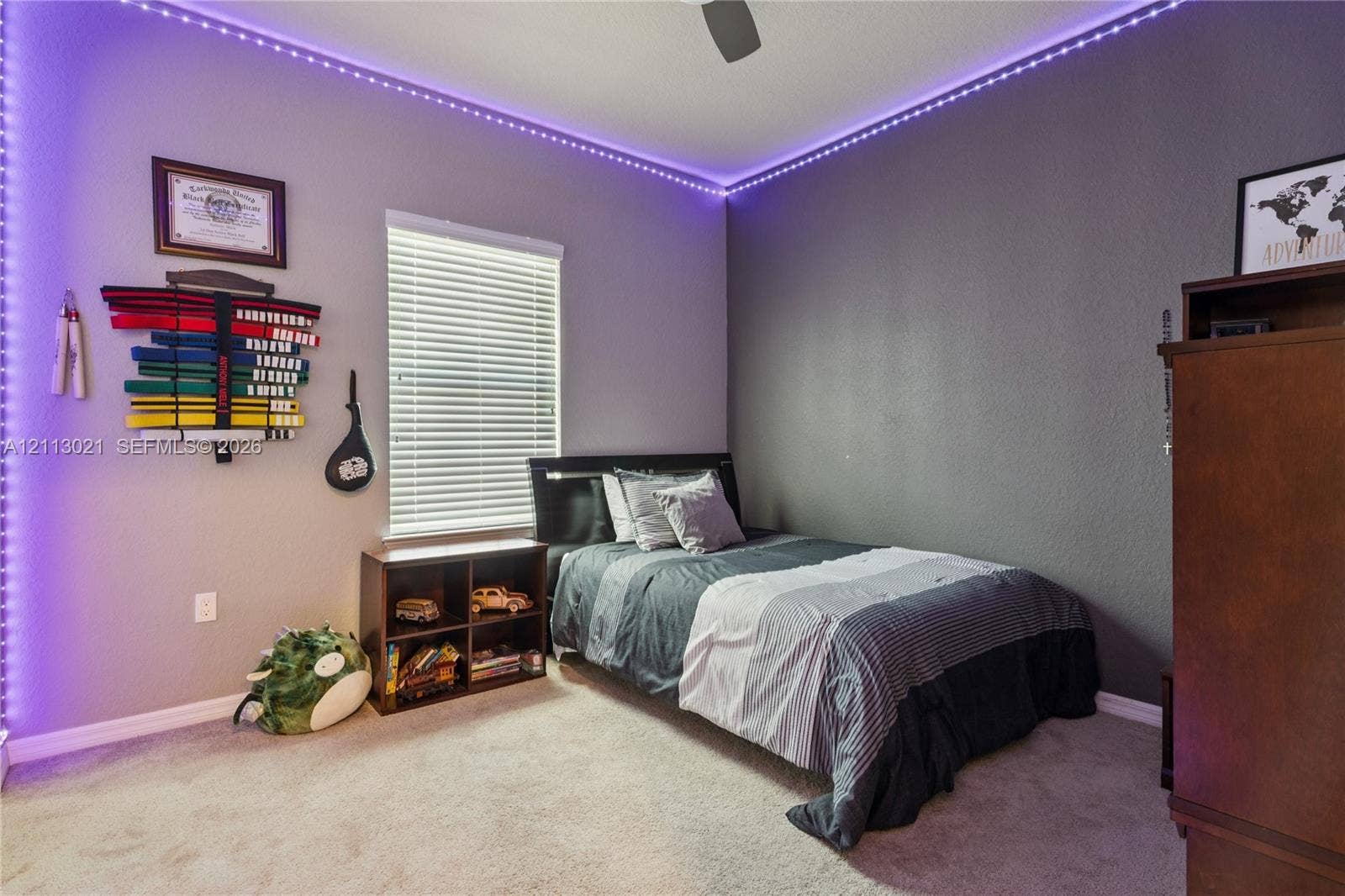 8228 Tailshot Court, Lake Worth, Lake Worth, FL 33467 Bedroom featuring neutral carpeting, textured wall finish, integrated ceiling fan, and window with horizontal blinds
