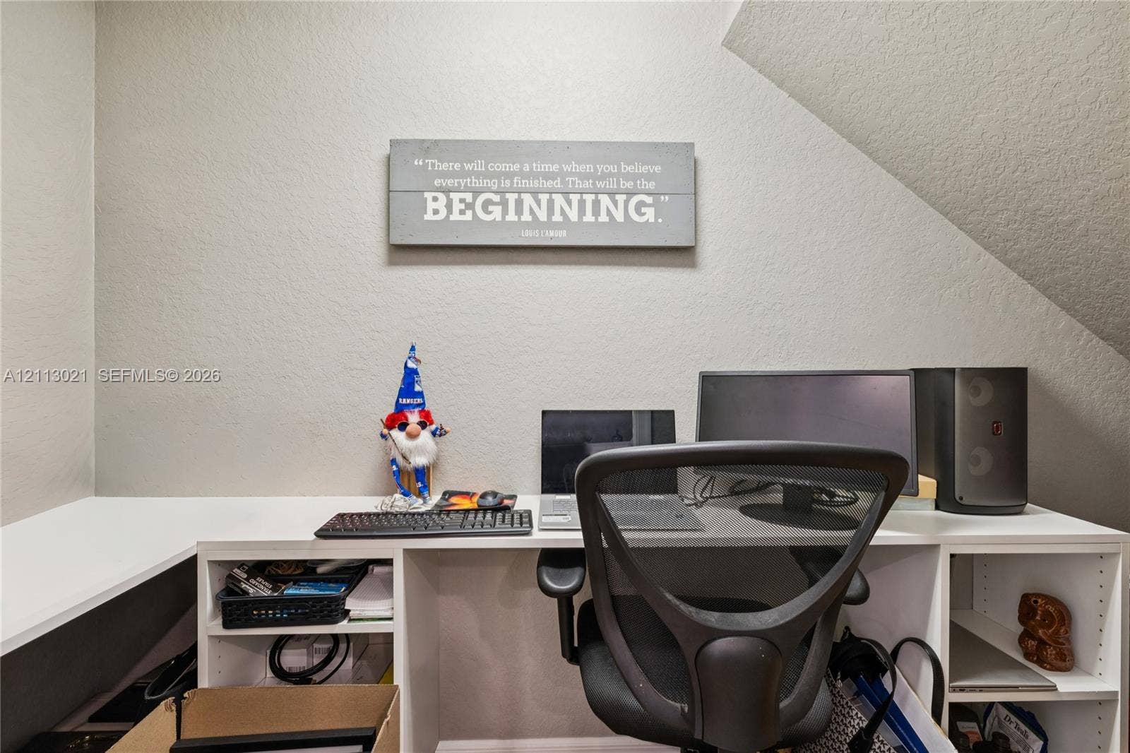 8228 Tailshot Court, Lake Worth, Lake Worth, FL 33467 Built-in white desk featuring open shelving and a solid-surface desktop