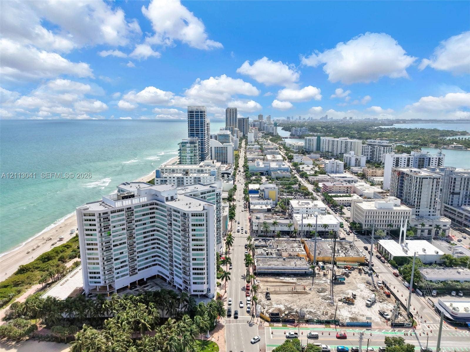 7135 Collins Avenue, #1426, Miami Beach, FL 33141 Aerial perspective of coastal high-rise development featuring direct oceanfront exposure, expansive shoreline, and proximity to metropolitan infrastructure