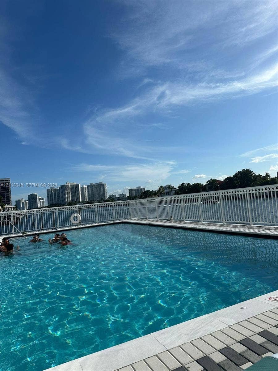 1913 S Ocean Drive, #227, Hallandale Beach, Hallandale Beach, FL 33009 Waterfront swimming pool with tiled coping and a perimeter safety fence