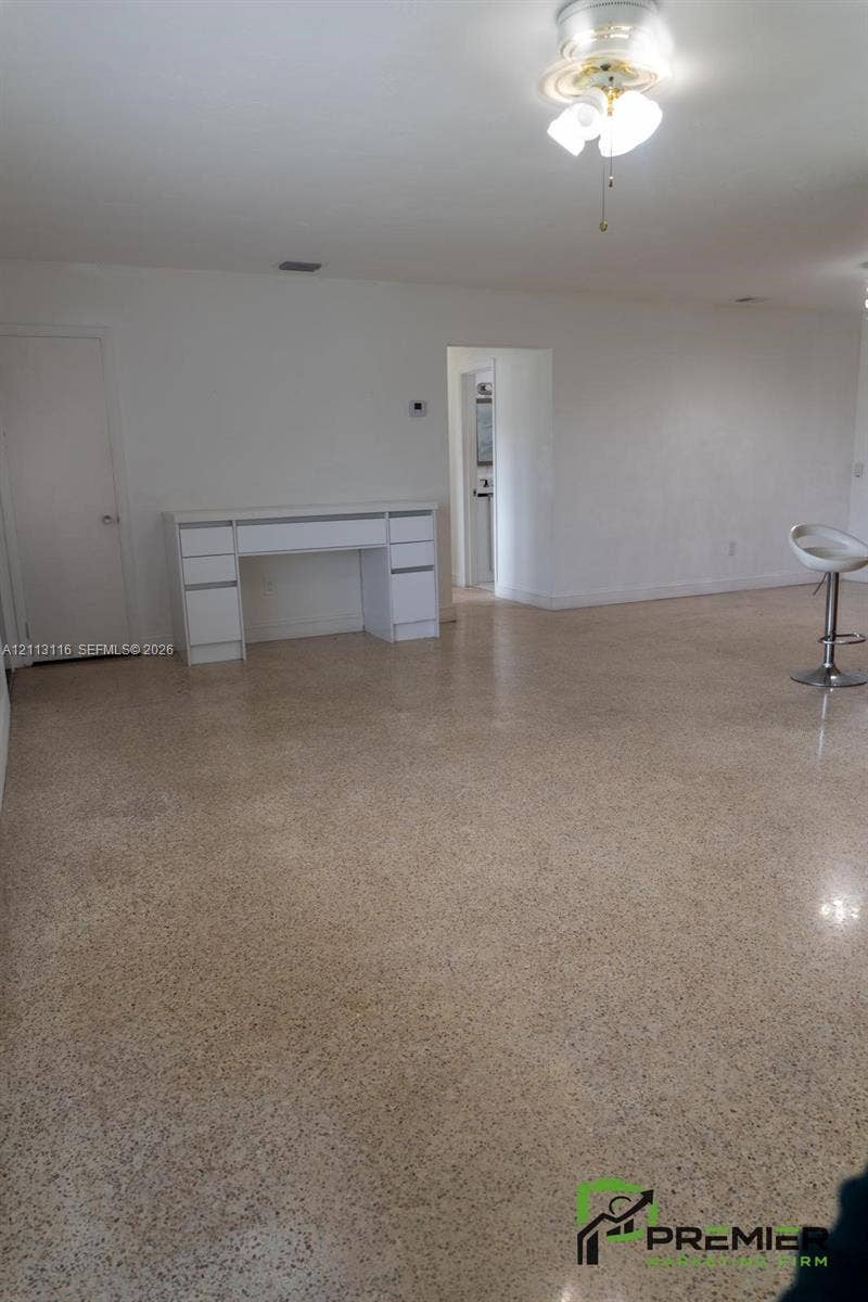 4341 NW 178th Drive, Miami Gardens, FL 33055 Polished terrazzo flooring, built-in white cabinetry, and multi-globe ceiling-mounted lighting
