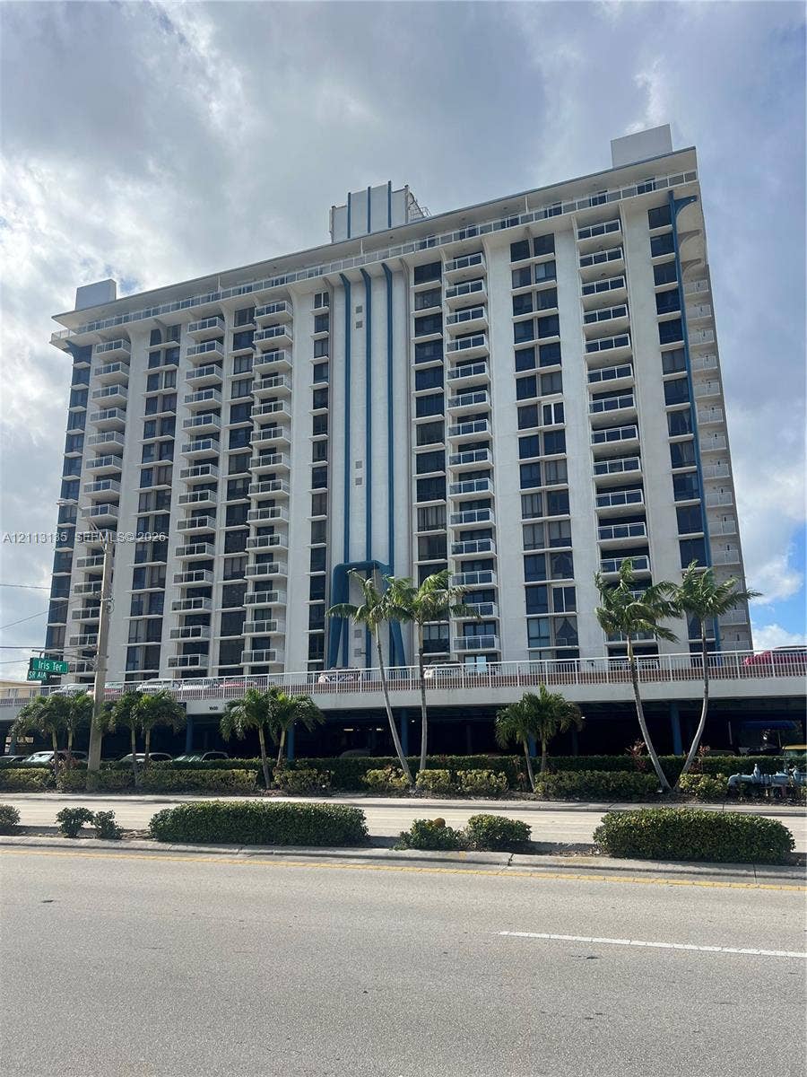 1600 S Ocean Drive, #3A, Hollywood, FL 33019 High-rise building featuring a white facade with blue vertical architectural accents and multiple levels of private balconies