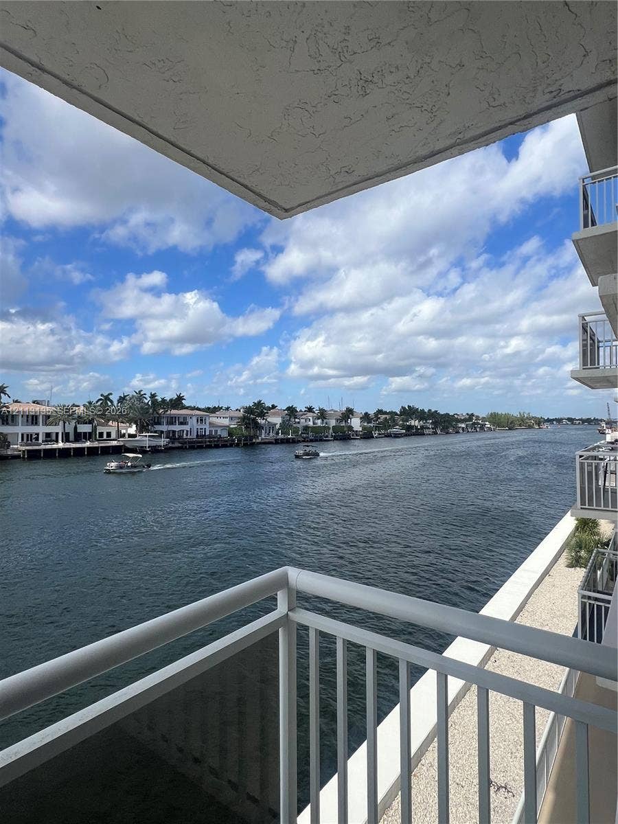 1600 S Ocean Drive, #3A, Hollywood, FL 33019 Covered balcony featuring metal railings and direct exposure to a deep-water canal