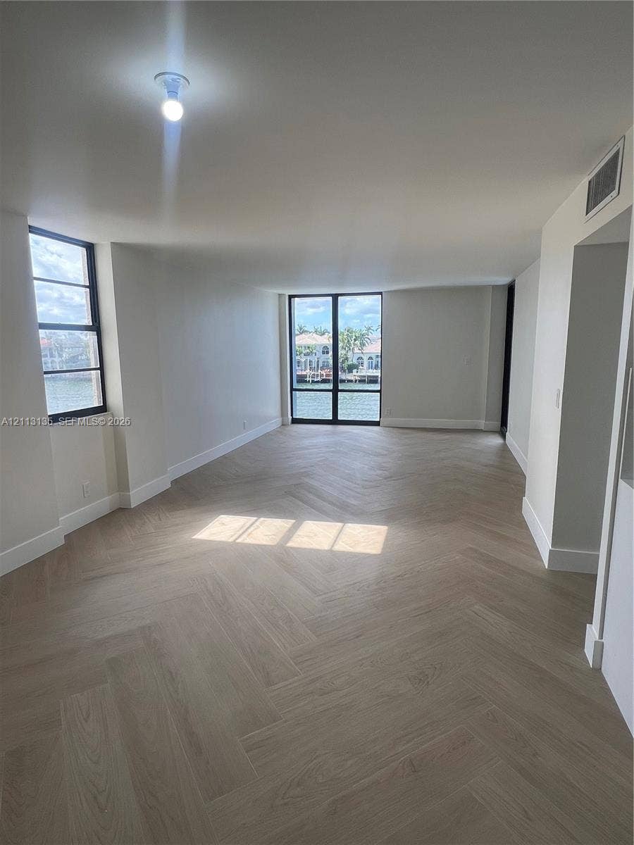 1600 S Ocean Drive, #3A, Hollywood, FL 33019 Herringbone wood-finish flooring, floor-to-ceiling windows, and water-facing exterior exposure