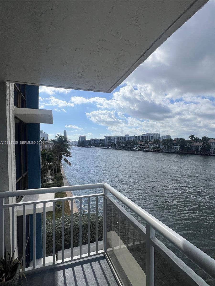 1600 S Ocean Drive, #3A, Hollywood, FL 33019 Covered balcony featuring white metal railings and concrete flooring overlooking a waterfront canal