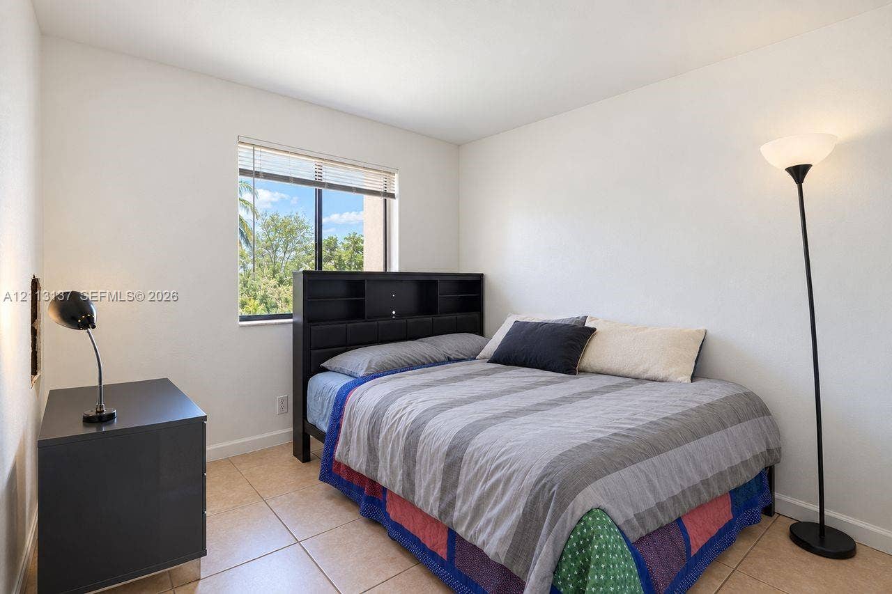 10884 Royal Palm Boulevard, #10884, Coral Springs, FL 33065 Neutral interior featuring tile flooring and a single-pane window with integrated blinds