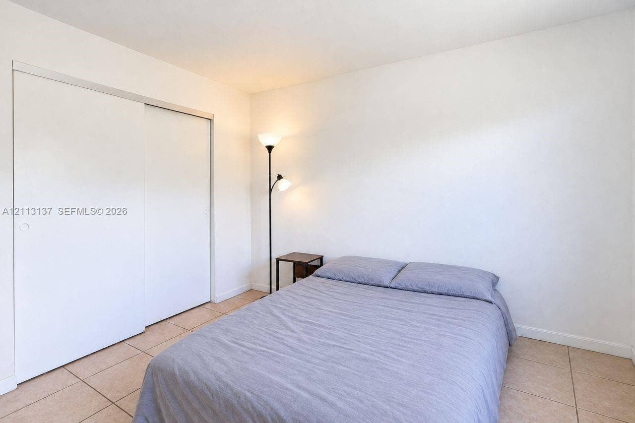 10884 Royal Palm Boulevard, #10884, Coral Springs, FL 33065 Ceramic tile flooring and a double-panel sliding closet