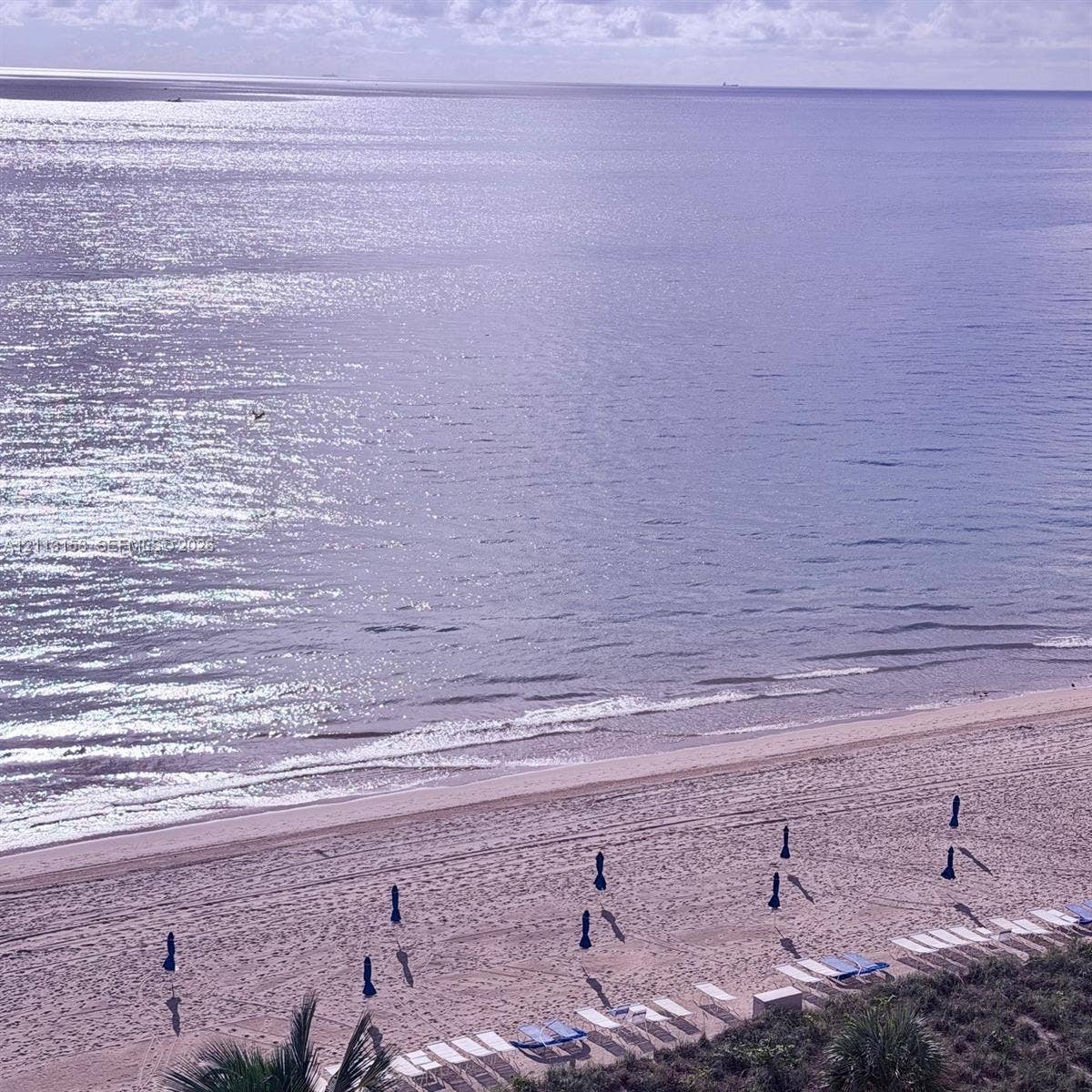 Direct oceanfront exposure featuring expansive sandy beach access