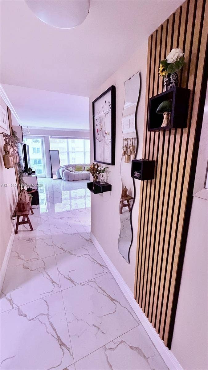 Polished tile flooring with marble-patterned veining and vertical wood slat wall detailing