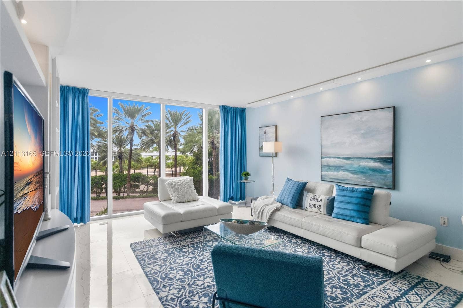 10275 Collins Avenue, #229, Bal Harbour, FL 33154 Floor-to-ceiling windows, polished stone flooring, and recessed ceiling lighting