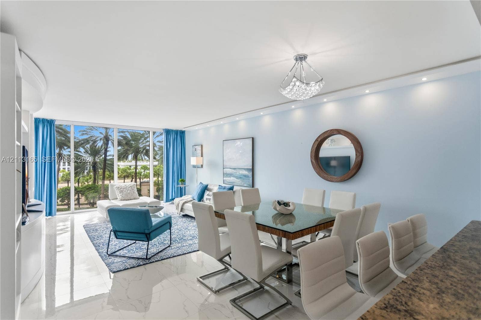 10275 Collins Avenue, #229, Bal Harbour, FL 33154 Floor-to-ceiling glass windows, polished tile flooring, recessed ceiling lighting, decorative crystal-style chandelier, and built-in cabinetry