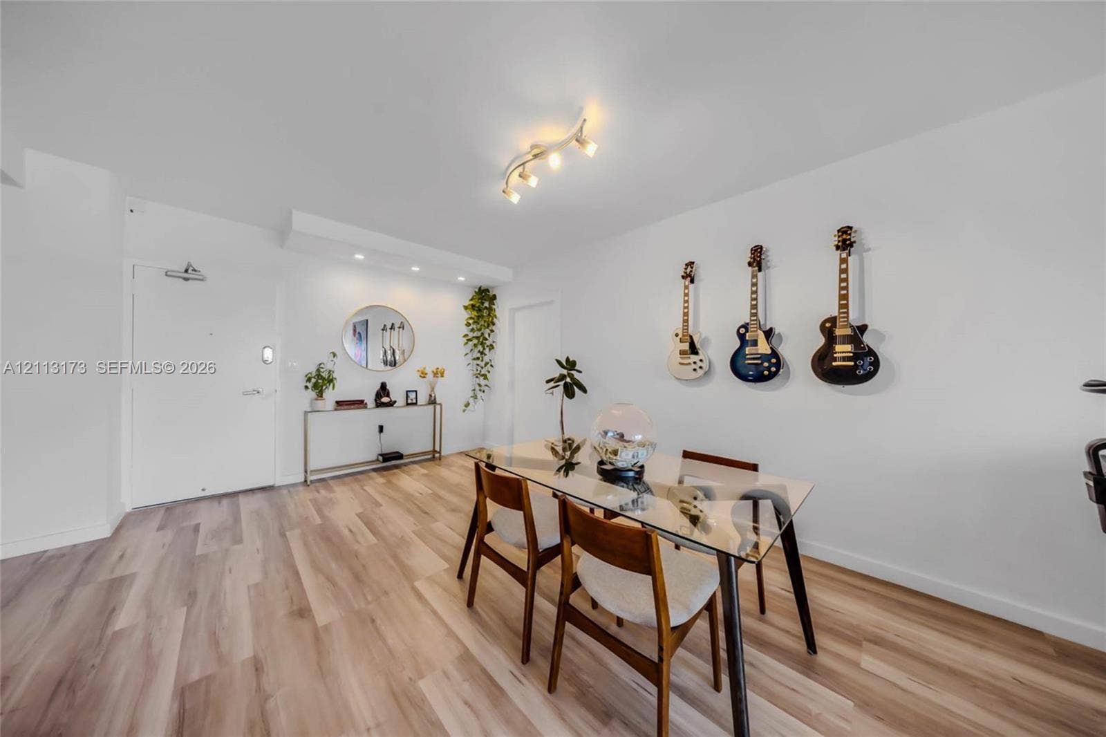 300 Bayview Drive, #1614, Sunny Isles Beach, FL 33160 Wood-finish flooring, recessed lighting, and a multi-directional track lighting fixture