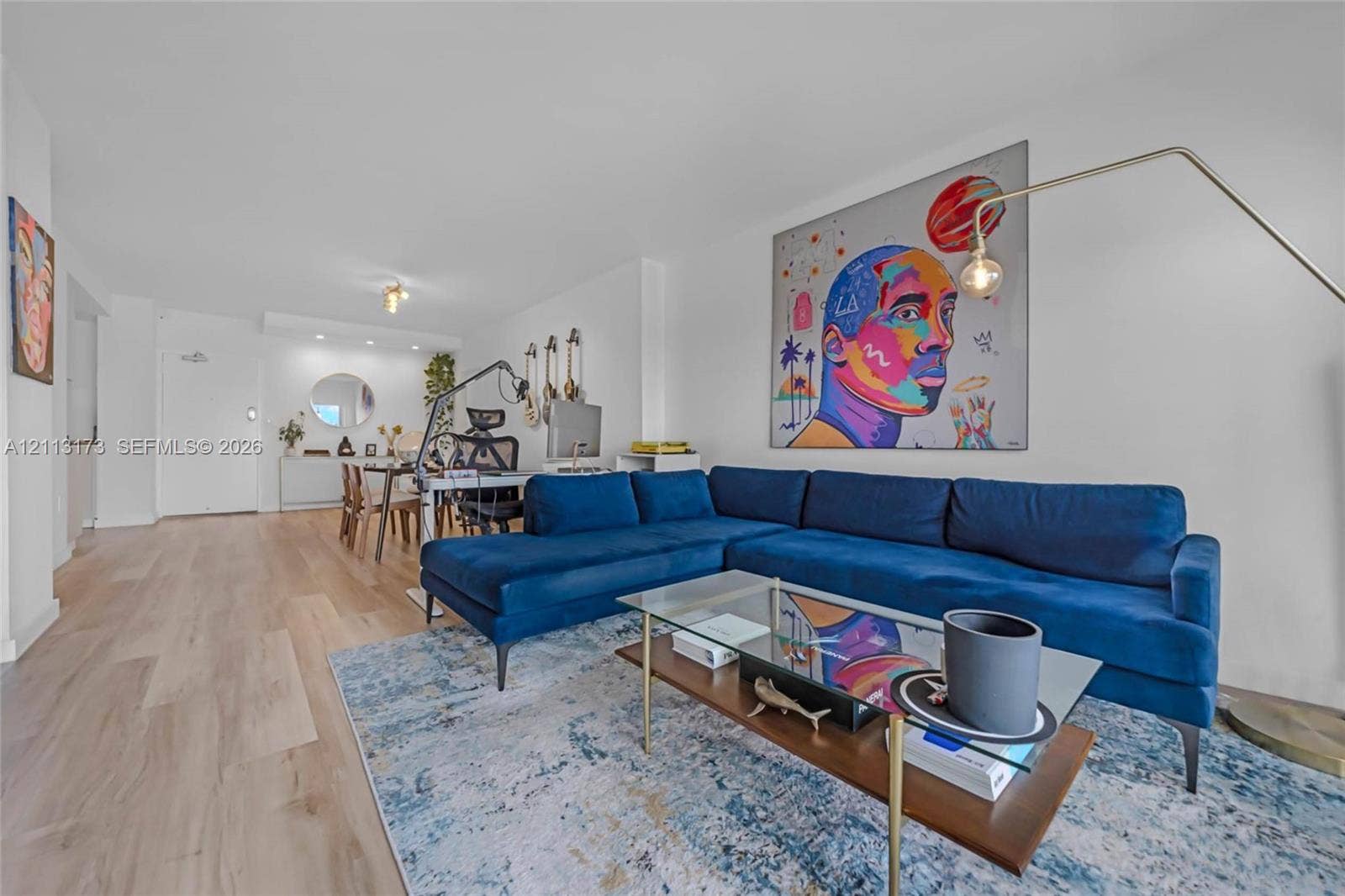 300 Bayview Drive, #1614, Sunny Isles Beach, FL 33160 Open-concept interior featuring wood-finish flooring, neutral walls, and recessed lighting