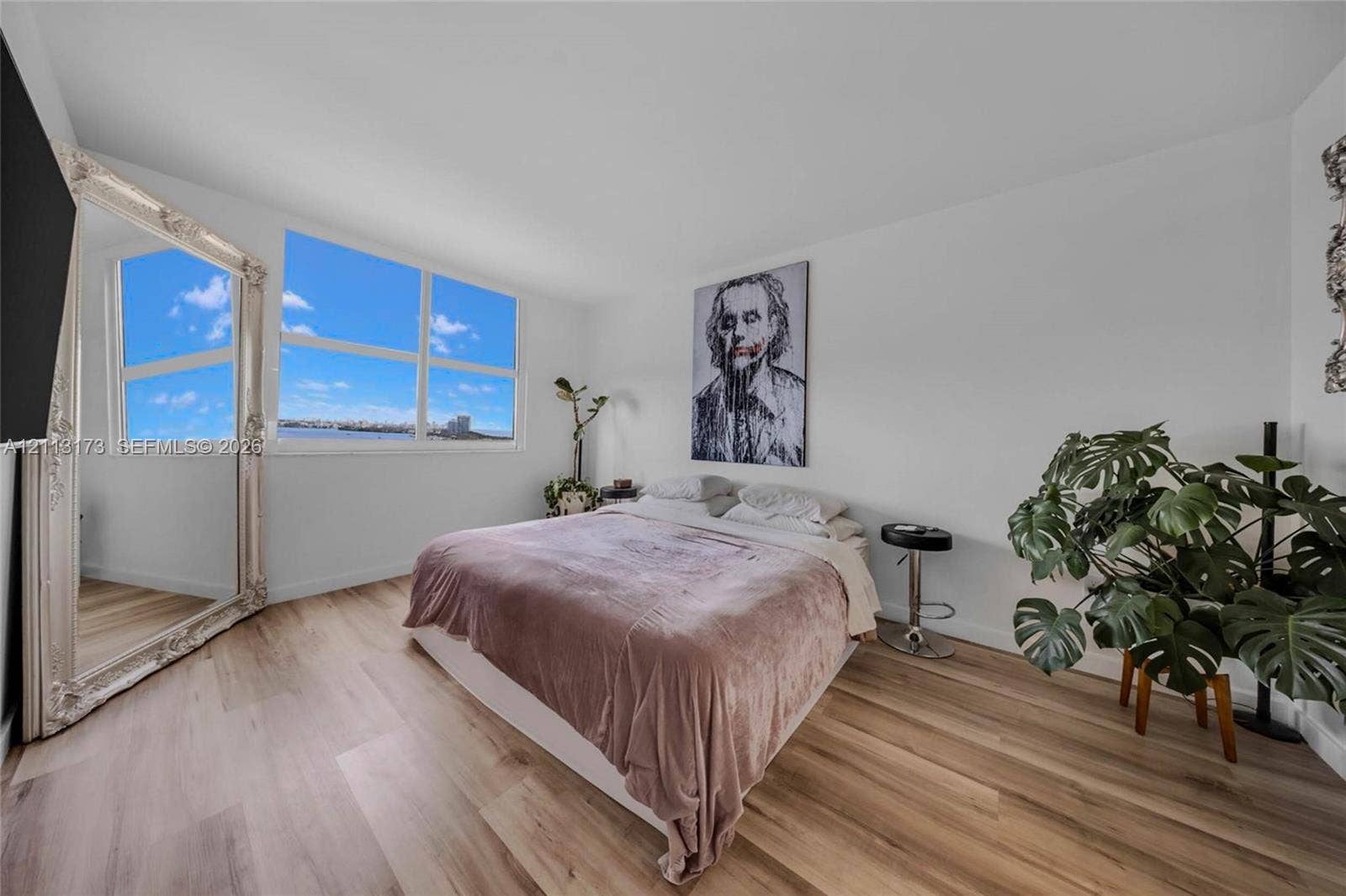 300 Bayview Drive, #1614, Sunny Isles Beach, FL 33160 Wood-finish flooring and large multi-pane windows providing natural light and coastal scenery