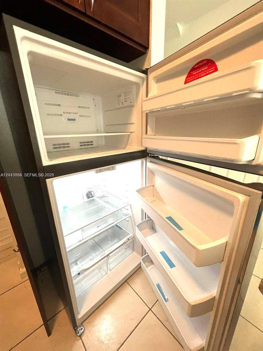 8706 NW 38th Drive, #2, Coral Springs, Coral Springs, FL 33065 Top-mount refrigerator with adjustable shelving, integrated door storage, and crisper drawers