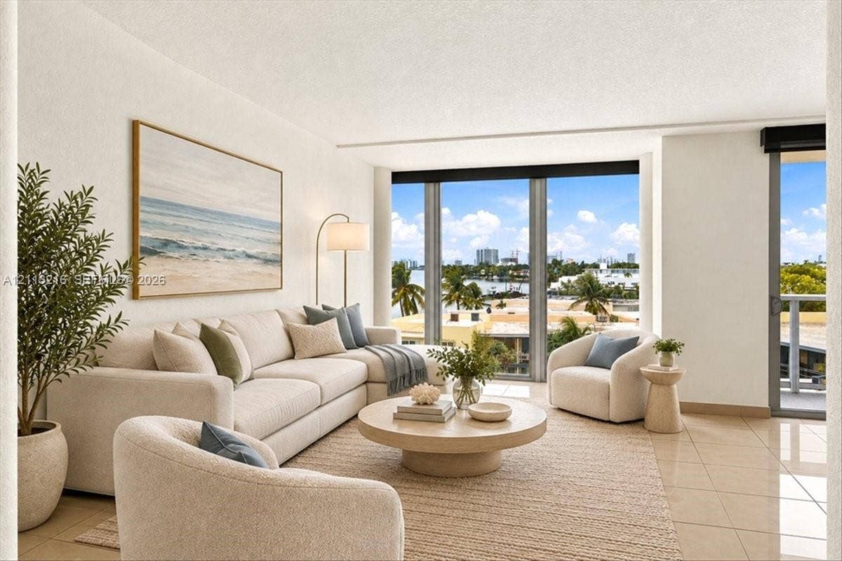 900 Bay Drive, #425, Miami Beach, FL 33141 Living area featuring floor-to-ceiling windows, tile flooring, and access to a private balcony