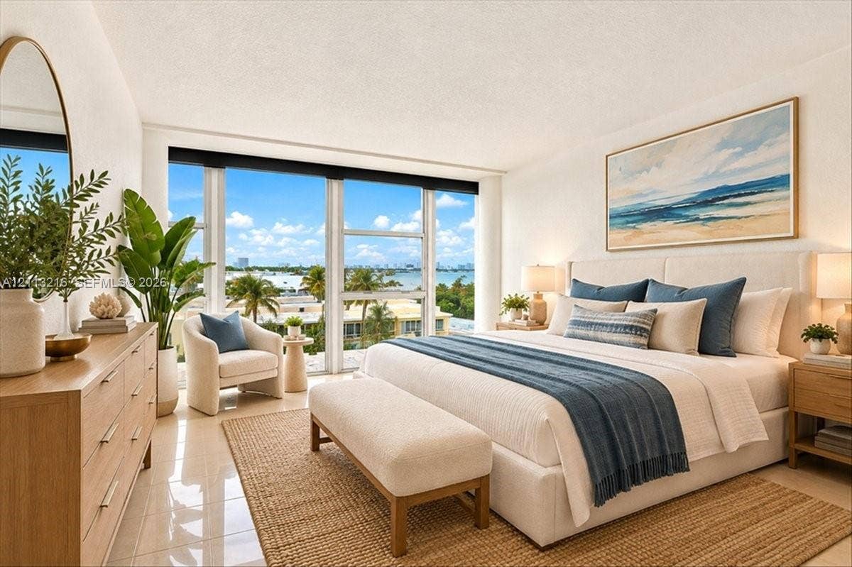 900 Bay Drive, #425, Miami Beach, FL 33141 Floor-to-ceiling windows featuring coastal scenery, tile flooring, and a neutral color palette