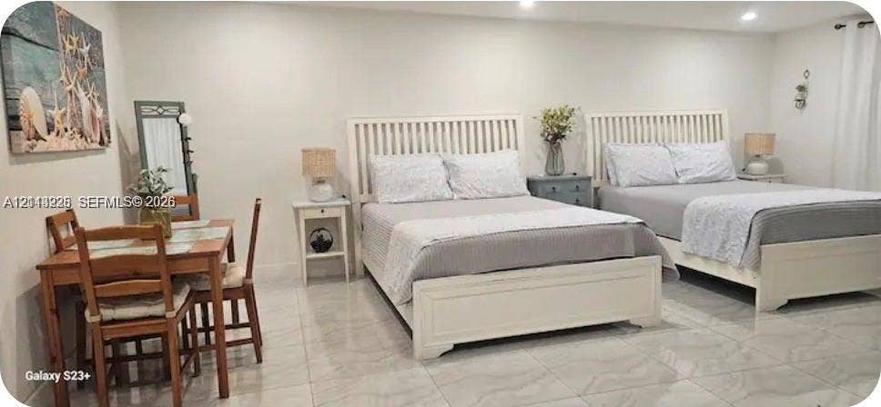144 NW 7th Avenue, #2, Dania, Dania Beach, FL 33004 Neutral-toned interior space featuring light-colored polished tile flooring and recessed ceiling lighting