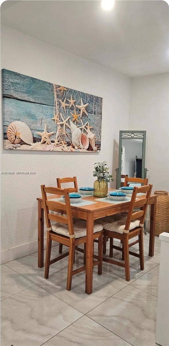 144 NW 7th Avenue, #2, Dania, Dania Beach, FL 33004 Large-format tile flooring set in a neutral tone with subtle veining, accompanied by recessed ceiling lighting
