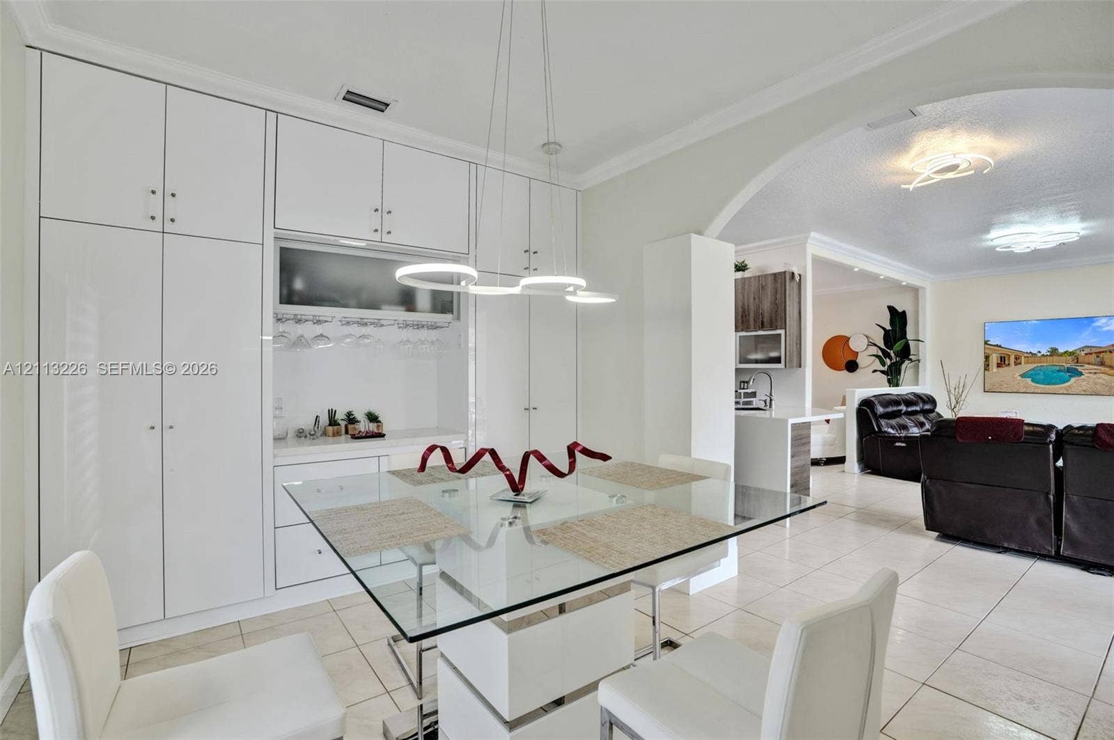 Floor-to-ceiling built-in cabinetry with integrated storage and tile flooring
