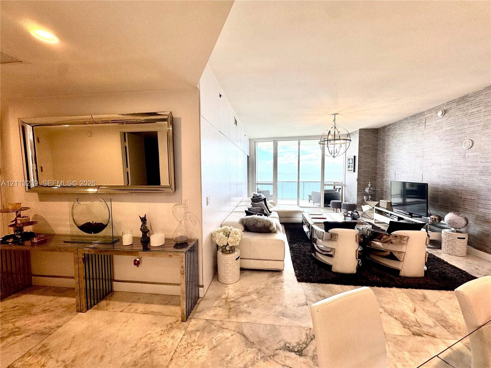 16001 Collins Avenue, #2403, Sunny Isles Beach, Sunny Isles Beach, FL 33160 Large-format stone flooring, textured wall covering, floor-to-ceiling windows, and recessed lighting