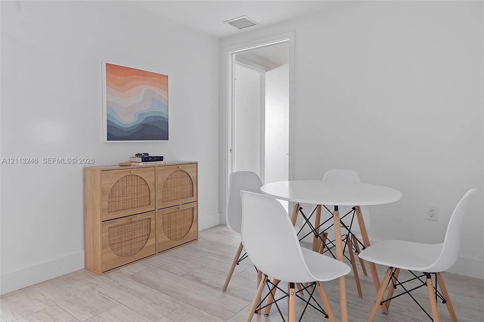 121 NE 34th Street, #2703, Miami, FL 33137 Neutral-toned wood-finish flooring and smooth, light-toned walls