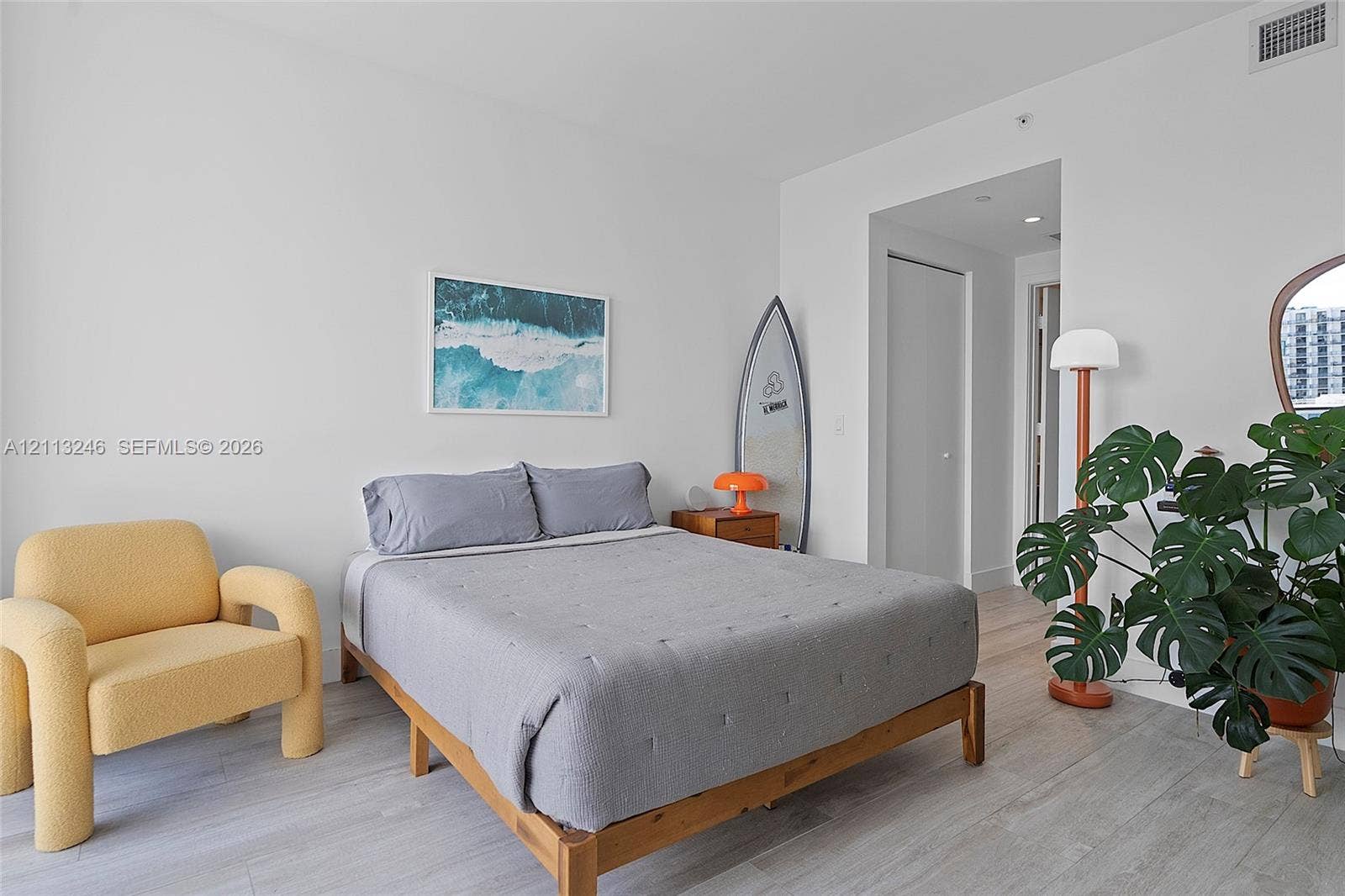 121 NE 34th Street, #2703, Miami, FL 33137 Neutral-toned wood-finish flooring, crisp white walls, and recessed ceiling lighting