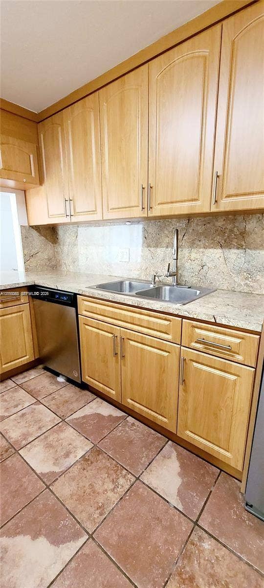 9410 Live Oak Place, #109, Davie, Davie, FL 33324 Kitchen featuring light-finish cabinetry, stone countertops, integrated backsplash, stainless steel dishwasher, and ceramic tile flooring