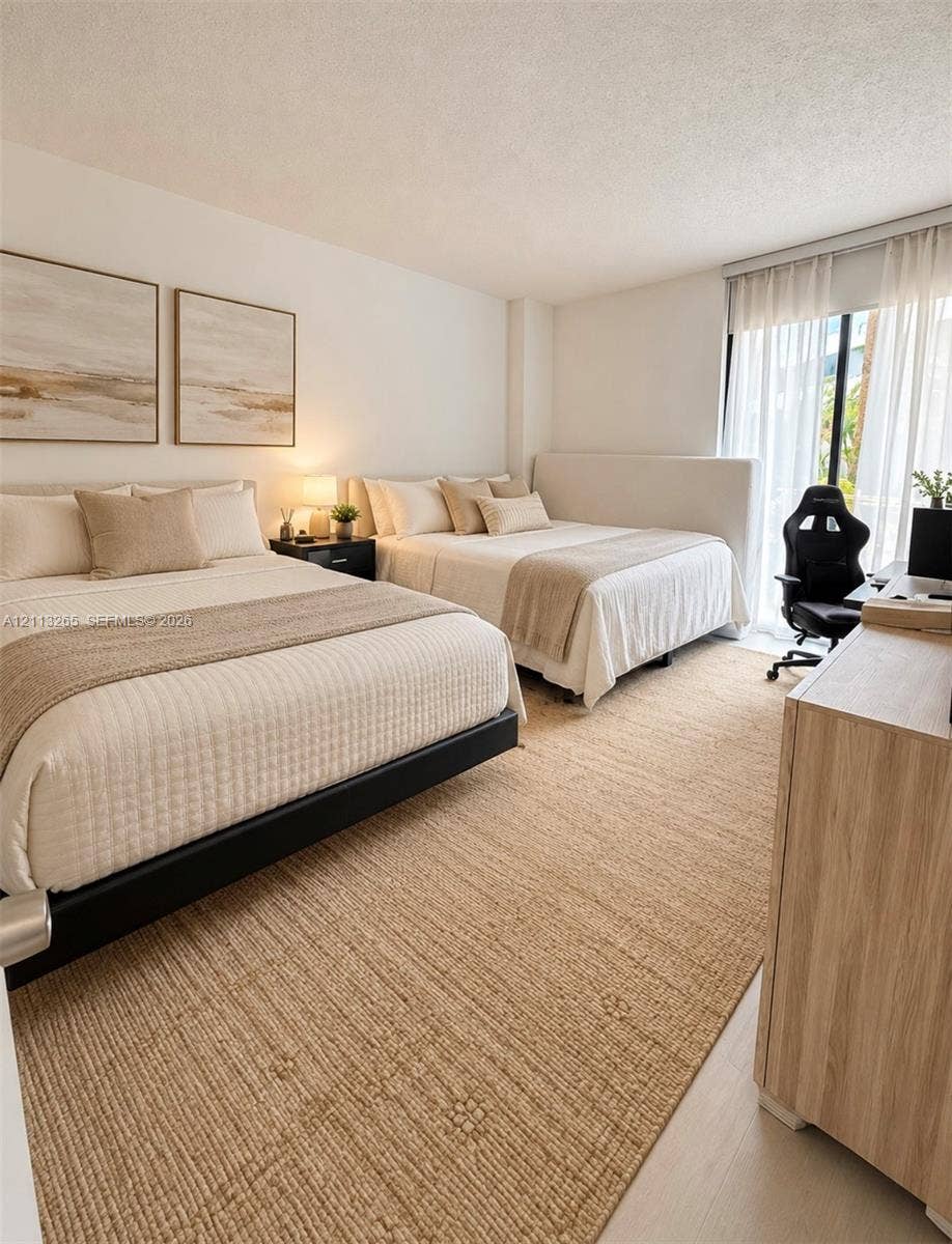Neutral-toned wood-finish flooring, large floor-to-ceiling window, and adjustable window roller shade