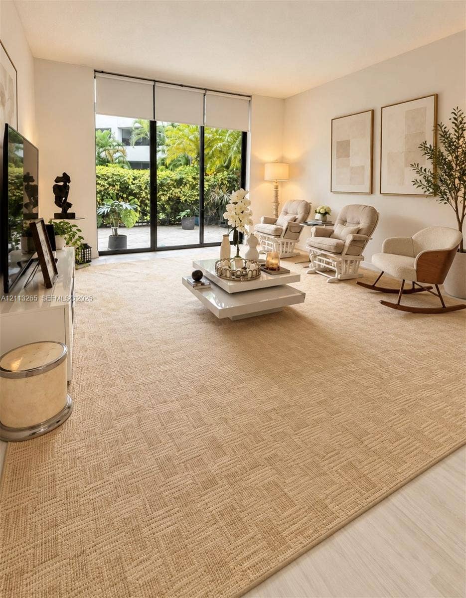 Wood-finish flooring, recessed ceiling lighting, and a multi-bulb track light fixture