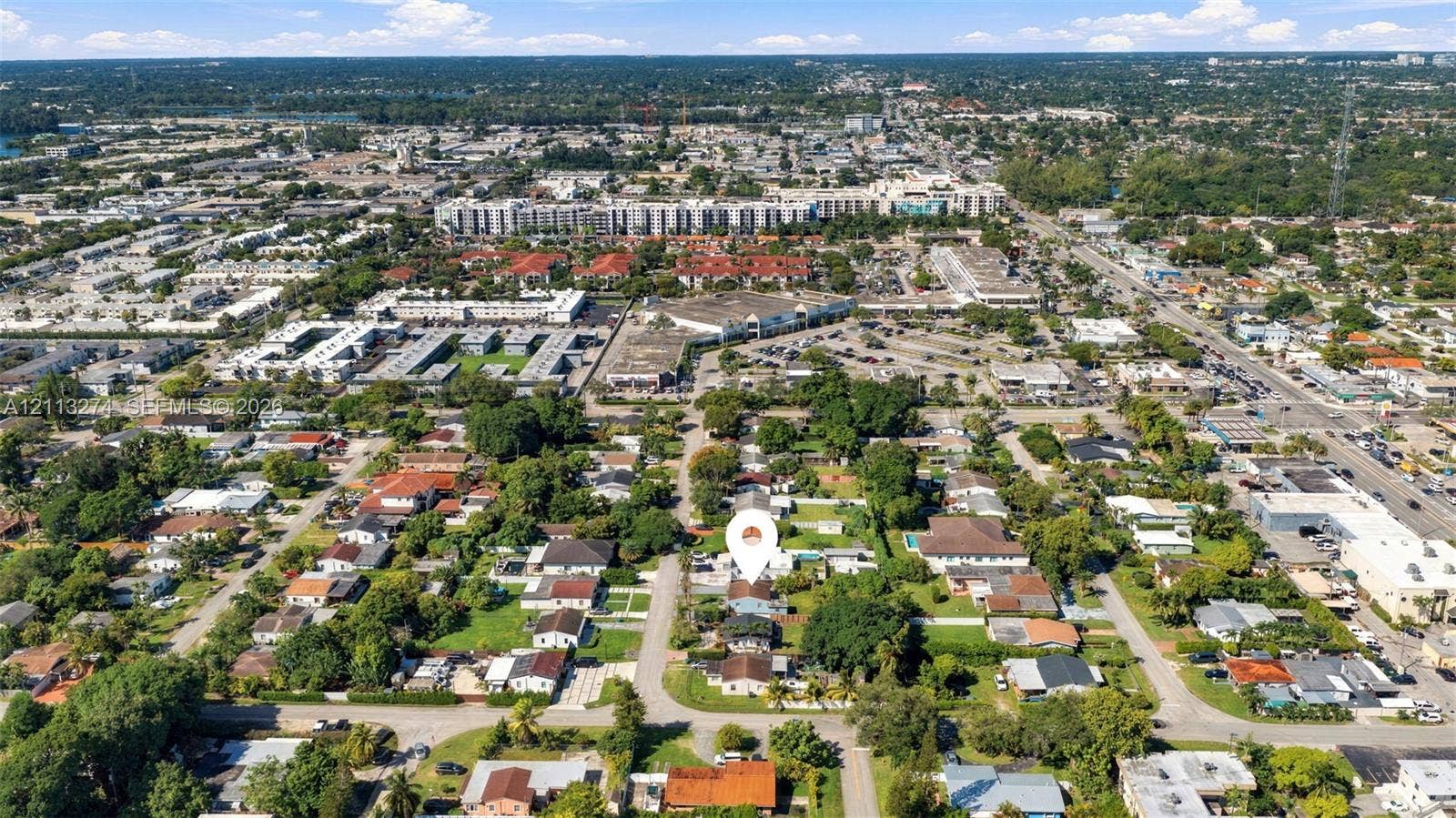 6521 SW 42nd Street, Miami, FL 33155 Aerial perspective featuring a residential lot with mature trees and a structured street grid