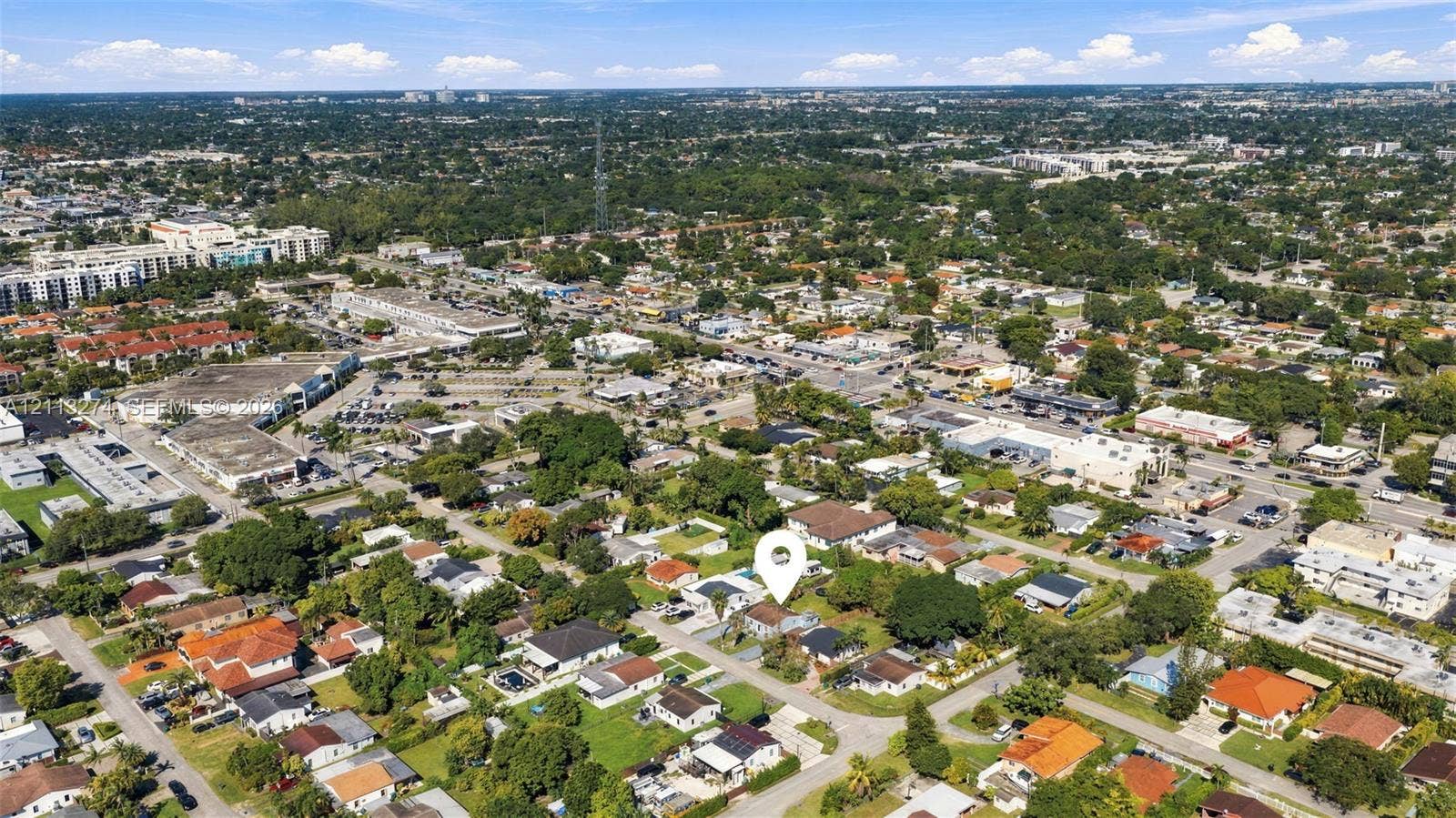 6521 SW 42nd Street, Miami, FL 33155 Aerial perspective of a residential lot featuring mature trees, landscaped greenery, and a suburban setting