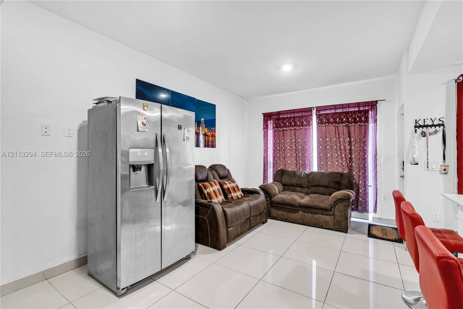 25880 SW 139th Path, #0, Homestead, FL 33032 Polished ceramic tile flooring throughout, stainless steel side-by-side refrigerator, and recessed ceiling lighting