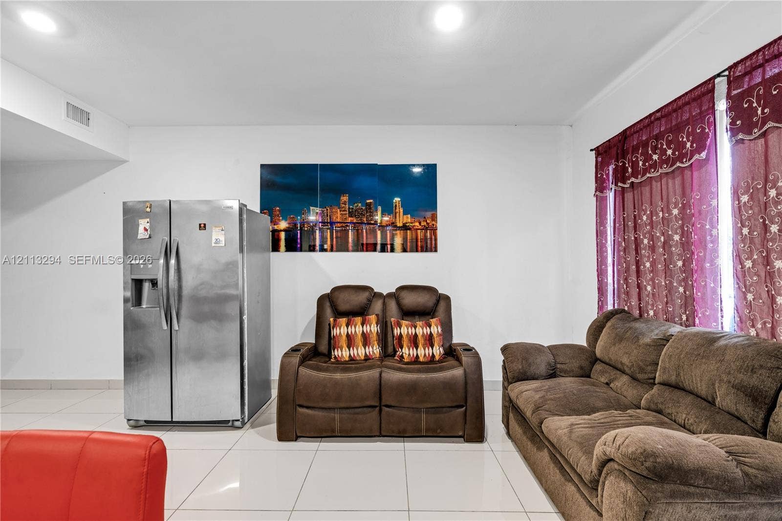 25880 SW 139th Path, #0, Homestead, FL 33032 Interior space featuring large-format white tile flooring, recessed ceiling lighting, and a stainless steel side-by-side refrigerator