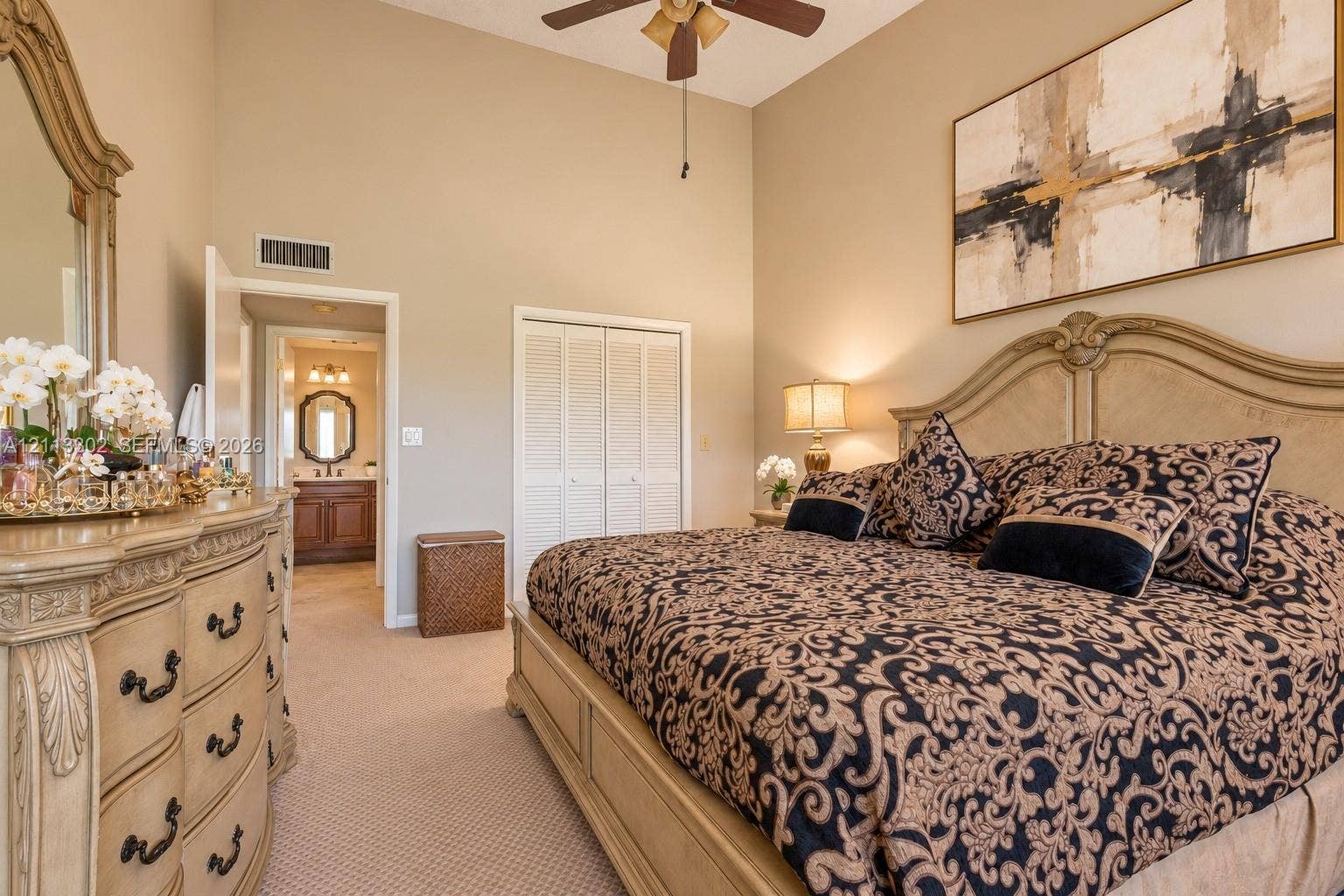 9450 Meadowood Drive, #202, Fort Pierce, FL 34951 Vaulted ceilings, carpeting, dual-paneled closet doors, and an attached ceiling fan