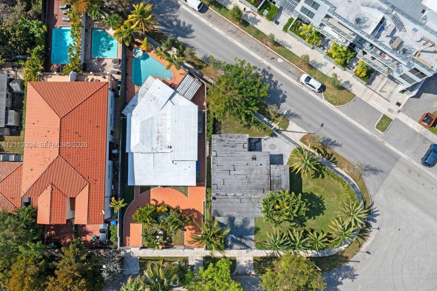 1810 SW 5th Avenue, #n/a, Miami, Miami, FL 33129 Aerial view of property featuring a swimming pool, paved patio, and mature palm trees