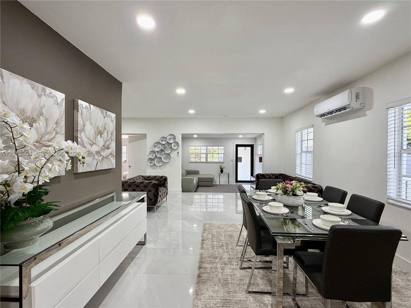 1810 SW 5th Avenue, #n/a, Miami, Miami, FL 33129 Open-concept space featuring polished tile flooring, recessed lighting, wall-mounted climate control unit, and crisp neutral wall tones
