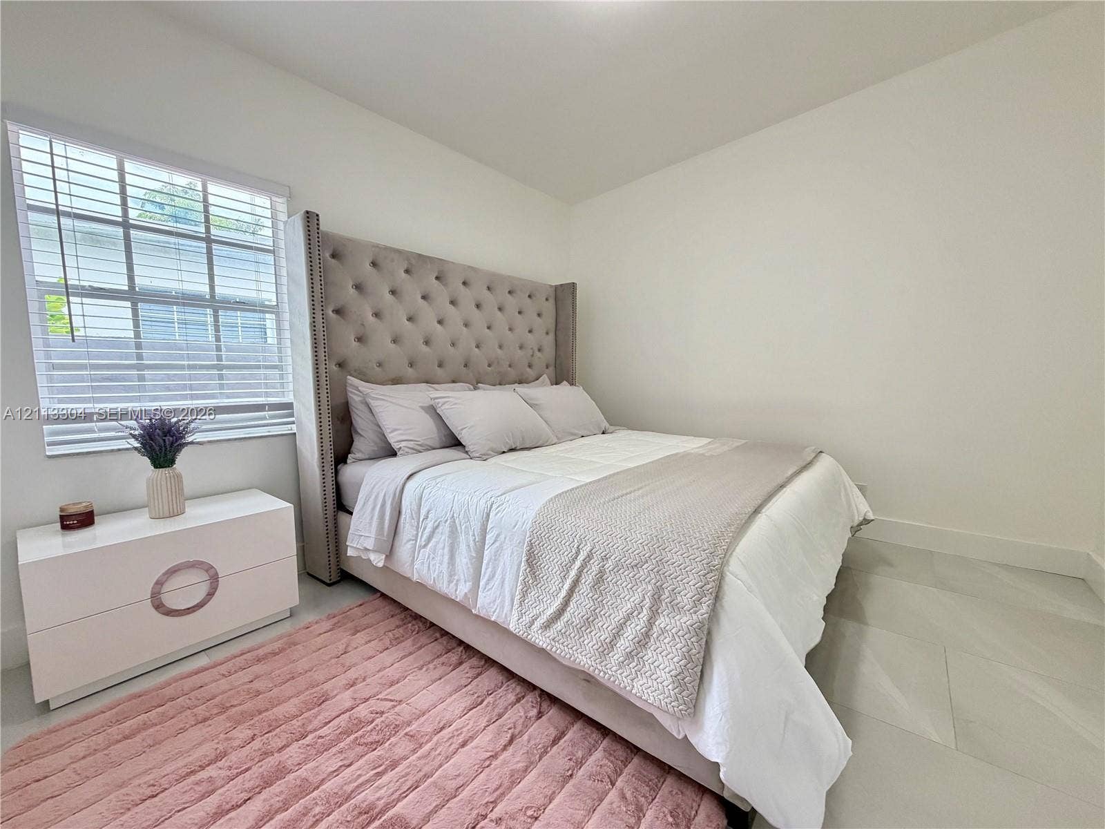1810 SW 5th Avenue, #n/a, Miami, Miami, FL 33129 Neutral wall paint, light-toned large format tile flooring, and multi-pane window with white horizontal blinds