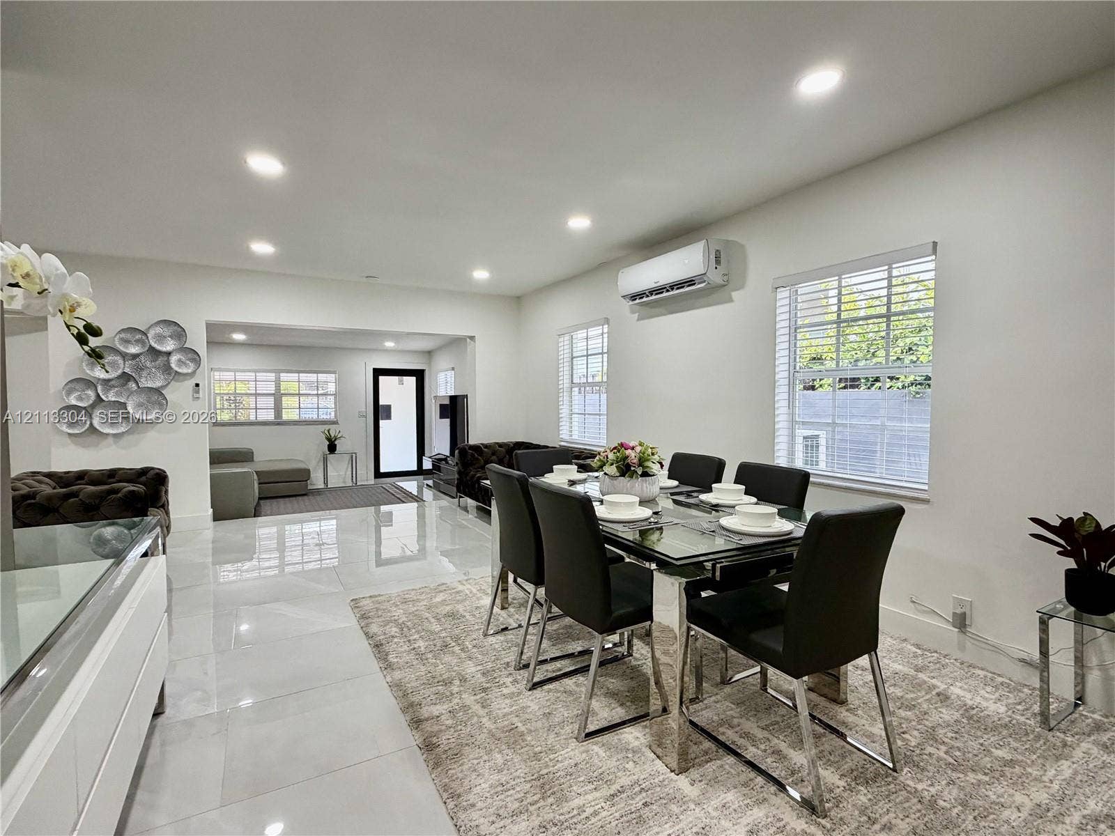1810 SW 5th Avenue, #n/a, Miami, Miami, FL 33129 Polished tile flooring, recessed lighting, wall-mounted climate control unit, and multiple windows with white horizontal blinds
